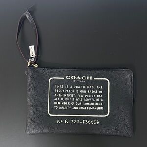 Coach NWT Black Textured Large Wristlet. Black w Maroon Tubing & Gold Hardware.